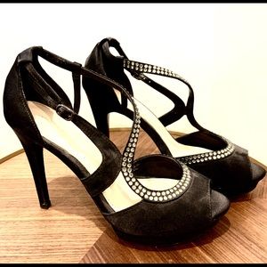 Black strapped high heels. Size 8